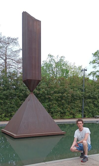 Éamon Ó Caoineachán by the Broken Obelisk sculpture.