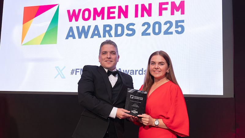 Aaron O'Doherty, director, MKF Property Services, presents the excellence in service provider award to Lily Rowntree, BusinessRiver on behalf of Cristiana Besteliu
