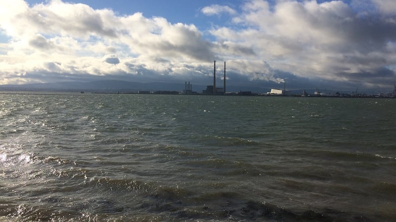Our first impression of the island was of a high sky, wind and sun, and the lovely mountain backdrop pierced only by the iconic red and white “ESB chimneys”