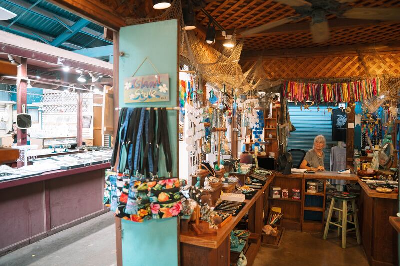 Margo Kemper, the owner of Seasteps, a souvenir shop, waits for customers at Kihei Kalama Village. Photograph: Michelle Mishina Kunz/New York Times