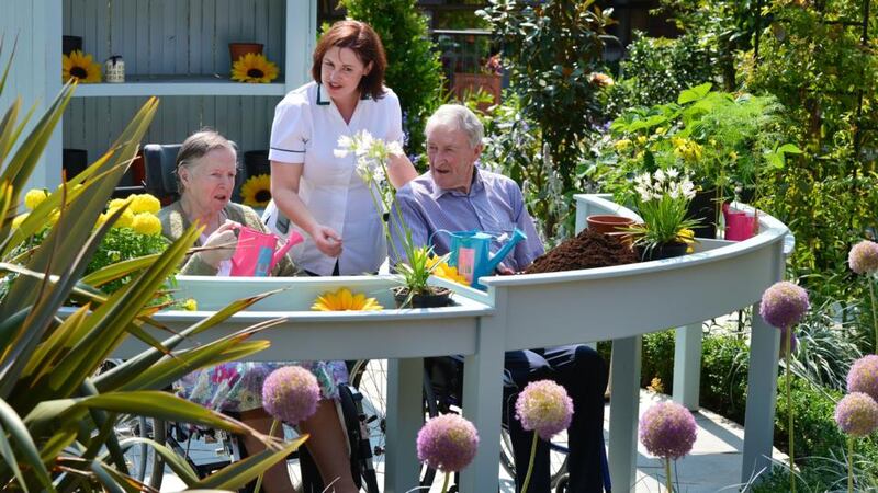Monica Devine, occupational therapist, with patients Sr Monica Marren and Patrick Armstrong. Photograph: Alan Betson