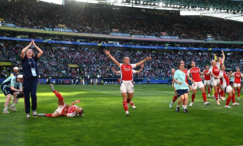 Katie McCabe (centre) celebrates with her Arsenal team-mates after the game. Photograph: Zed Jameson/PA