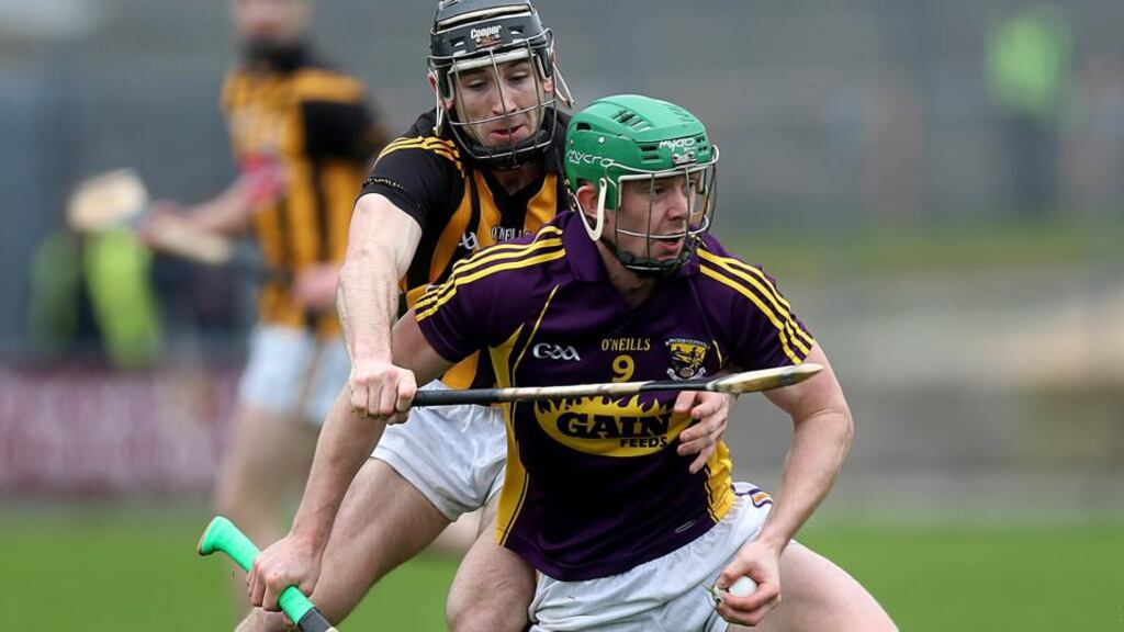 Wexford’s Harry Kehoe with Conor Fogarty of Kilkenny