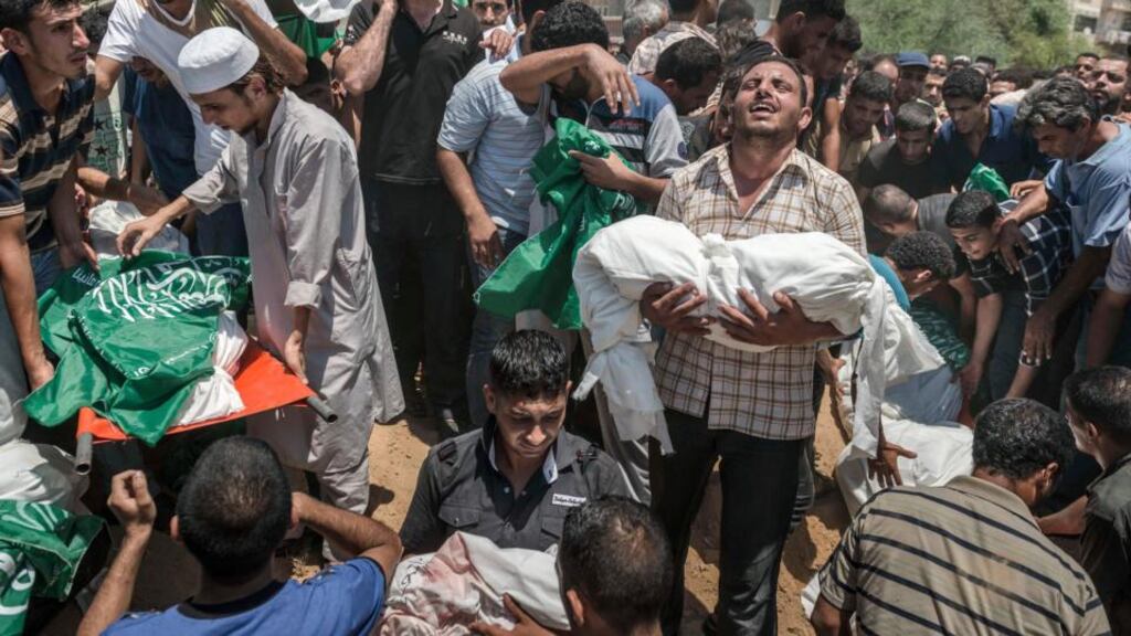 The bodies of members of the Abu Jamei family, who were killed in an Israeli airstrike, are buried in Khan Younis, Gaza Strip, on July 21st. Photograph: Sergey Ponomarev/The New York Times