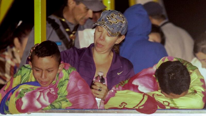 Survivors are comforted after the tourist boat ‘Almirante’ sank. Photograph: Getty