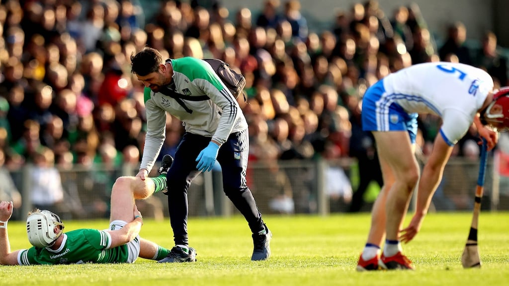 Limerick’s Cian Lynch receives treatment during Saturday’s win over Waterford. Photograph: Ryan Byrne/Inpho