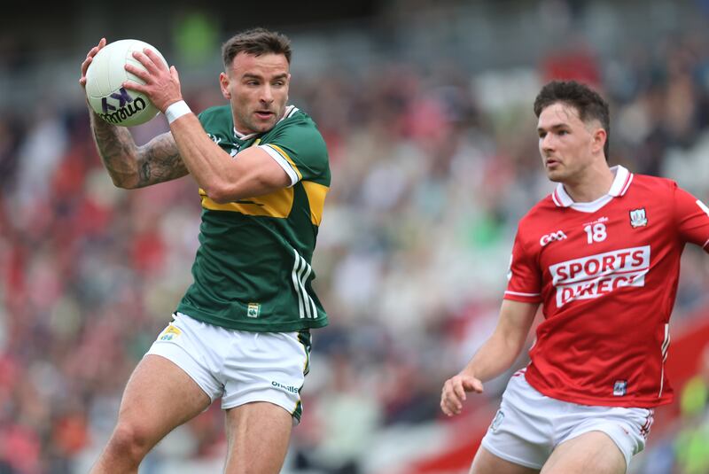 Kerry's Micheal Burns and Cork's Seán Brady. Photograph: Bryan Keane/Inpho