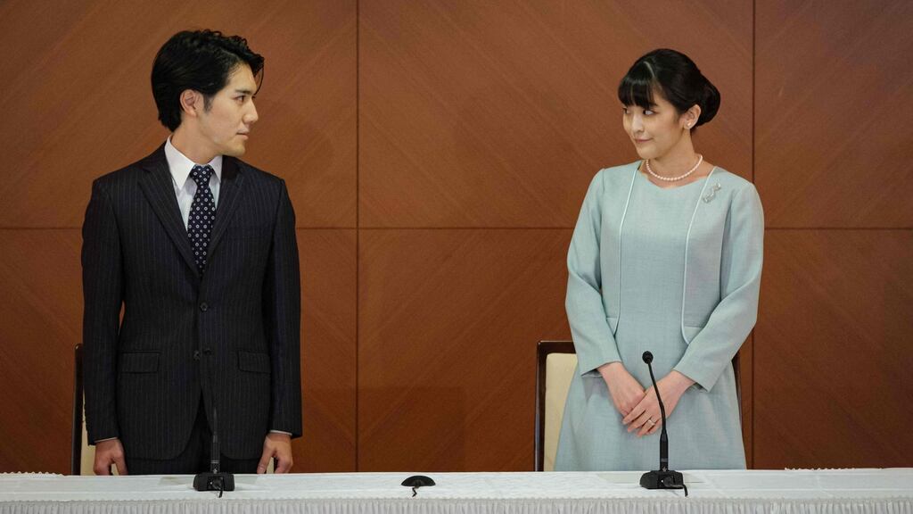 Japan’s princess Mako and her husband, Kei Komuro, who she met while at university, announce they have married at a press conference. Photograph: Nicolas Datiche/Pool/AFP via Getty