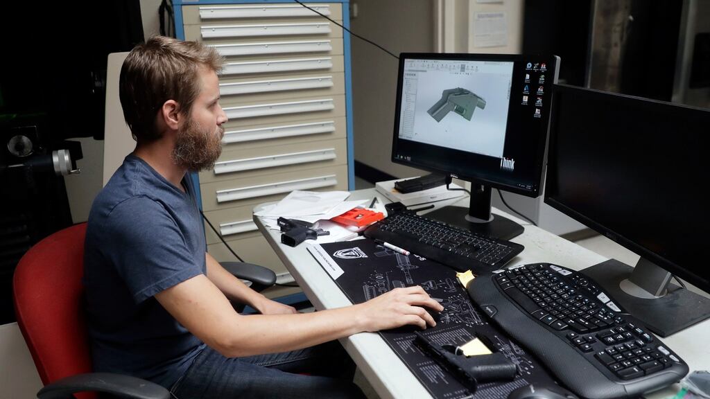 Ben Chalker shows the CAD software of a 3D-printable gun called the Liberator, at a factory in Austin, Texas.