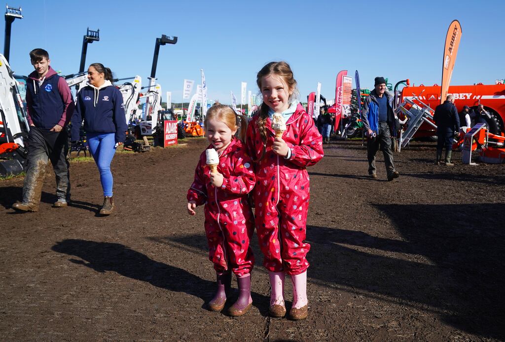 A file image of four-year-old Saorla Bater (left) and her sister Fiadh (7) enjoying an ice cream at the 2023 National Ploughing Championships at Ratheniska, Co Laois. Photograph: Brian Lawless/PA Wire