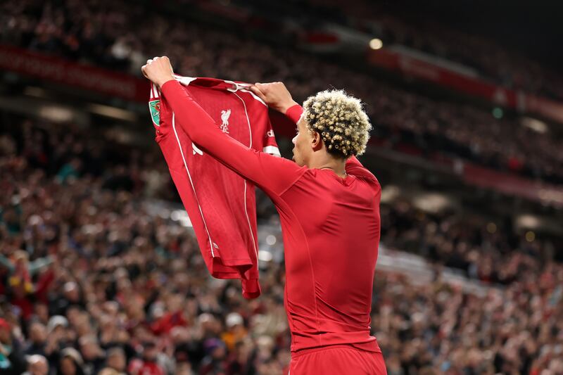 Hugo Ekitike of Liverpool celebrates scoring his team's second goal by removing his match shirt and subsequently receives a second yellow card. Photograph: Jan Kruger/Getty