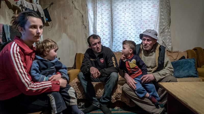 Shemsi Maliqi (right) a poor farmer whose son Alejhim joined  Islamic State  in Syria, with family in Gjilan, Kosovo. Photograph: Andrew Testa/New York Times