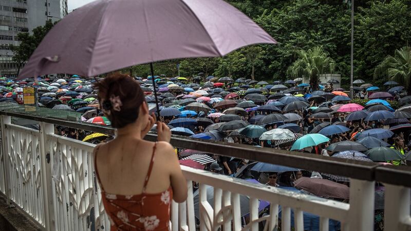 Protesters carrying umbrellas take part in an anti-government march in Hong Kong, China, on Saturday. Photograph: Roman Pilipey/EPA