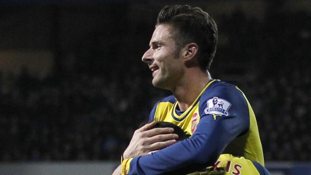 Arsenal’s Chilean striker Alexis Sanchez celebrates his goal with Olivier Giroud at Loftus Road tonight. Photograph: Ian Kington/AFP/Getty Images