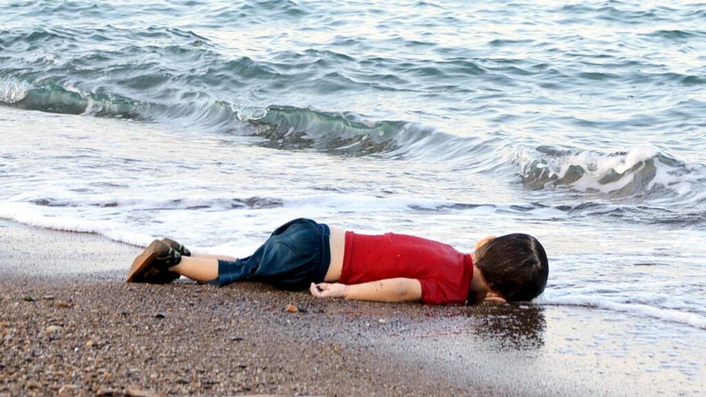 A young migrant, who drowned in a failed attempt to sail to the Greek island of Kos, lies on the shore in the Turkish coastal town of Bodrum, Turkey, September 2, 2015. Photograph: REUTERS/Nilufer Demir