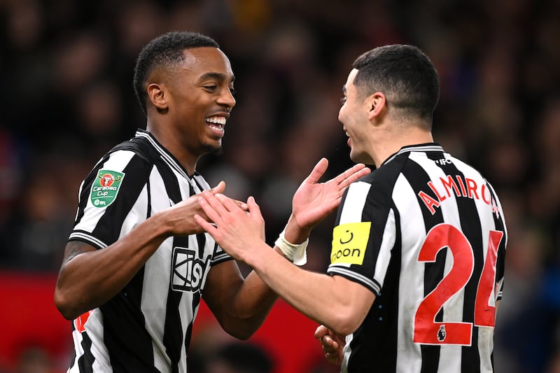 Joe Willock of Newcastle United celebrates with team mate Miguel Almiron. Photograph: Stu Forster/Getty