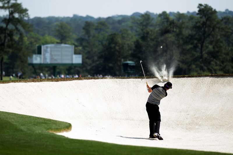 McIlroy hitting from a bunker on the second hole during the final round of the 2011 Masters. Photograph: David Cannon/Getty Images