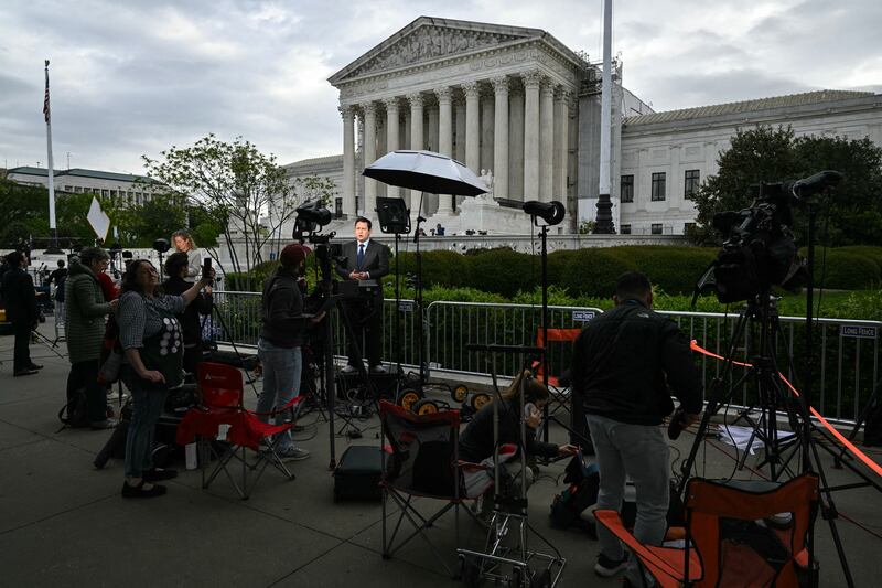 Members of the press work outside the US supreme court during arguments on the immunity of former US president Donald Trump. Photograph: Mandel Ngan/AFP via Getty Images