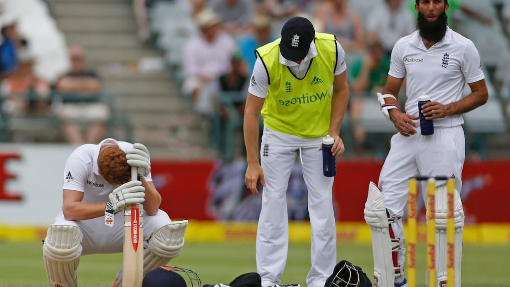England’s Jonny Bairstow looks down as he waits the results from the third empire with team member Moeen Ali during the second test against South Africa at Newlands. Photo: Schalk van Zuydam/Getty Images