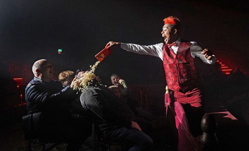 Arts and Entertainment 1st – No such thing as a free Lunch. Walison the Clown empties popcorn over and unsuspecting member of the audience during Tom Duffy’s Circus. Photograph: Niall Carson (PA Media)