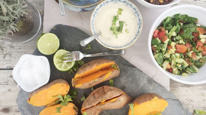 Baked sweet potatoes with black beans and cashew sour cream.