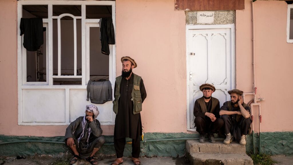 Sultan Mohammad (46) second from left, who said he commanded 15 Taliban fighters, inside a guarded compound in Faizabad, Afghanistan. Photograph: Jim Huylebroek/The New York Times