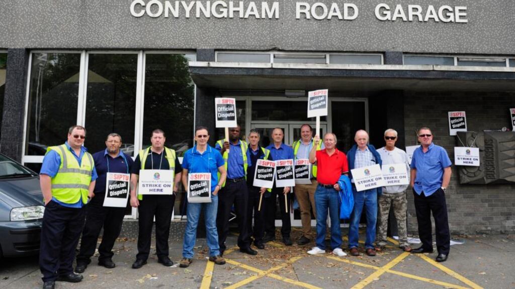 Bus drivers strike outside Dublin Bus’s Conyngham Road Garage in Dublin city. Pickets have been placed on all Dublin bus garages in the city. Photograph: Aidan Crawley