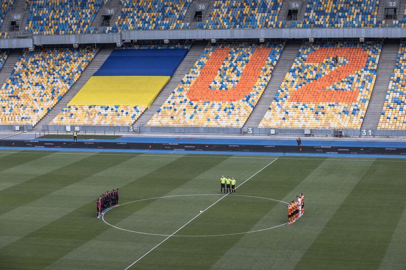 Players of Shakhtar Donetsk and Metalist 1925 Kharkiv observe a minute of silence for those who were killed during the Russian invasion of Ukraine. Photograph: Roman Pilipey/EPA