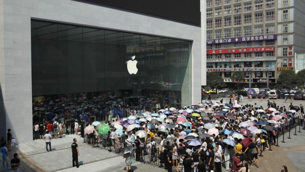 Crowds gather at Chongqing’s first Apple direct-sale store last month. In Europe, the firm estimates 497,000 jobs are directly attributable to its App Store. Photograph: FotoPress via Getty Images