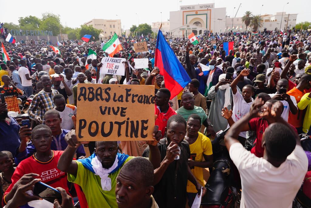 Nigeriens march in support of coup leader General Abdourahmane Tchiani in Niamey, Niger. The sign reads ‘Down with France, long live Putin’. Photograph: Sam Mednick/AP/PA
