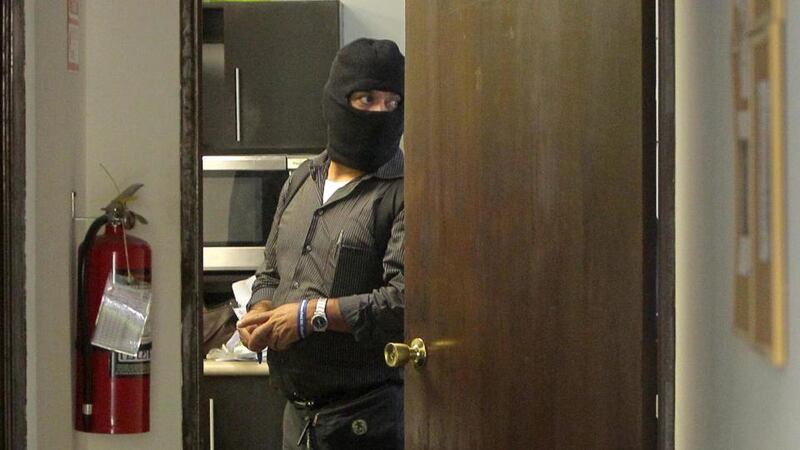 Agents of the National Civil Police of El Salvador seize the office of the Panamanian firm Mossack Fonseca. Photograph: Oscar Rivera/EPA