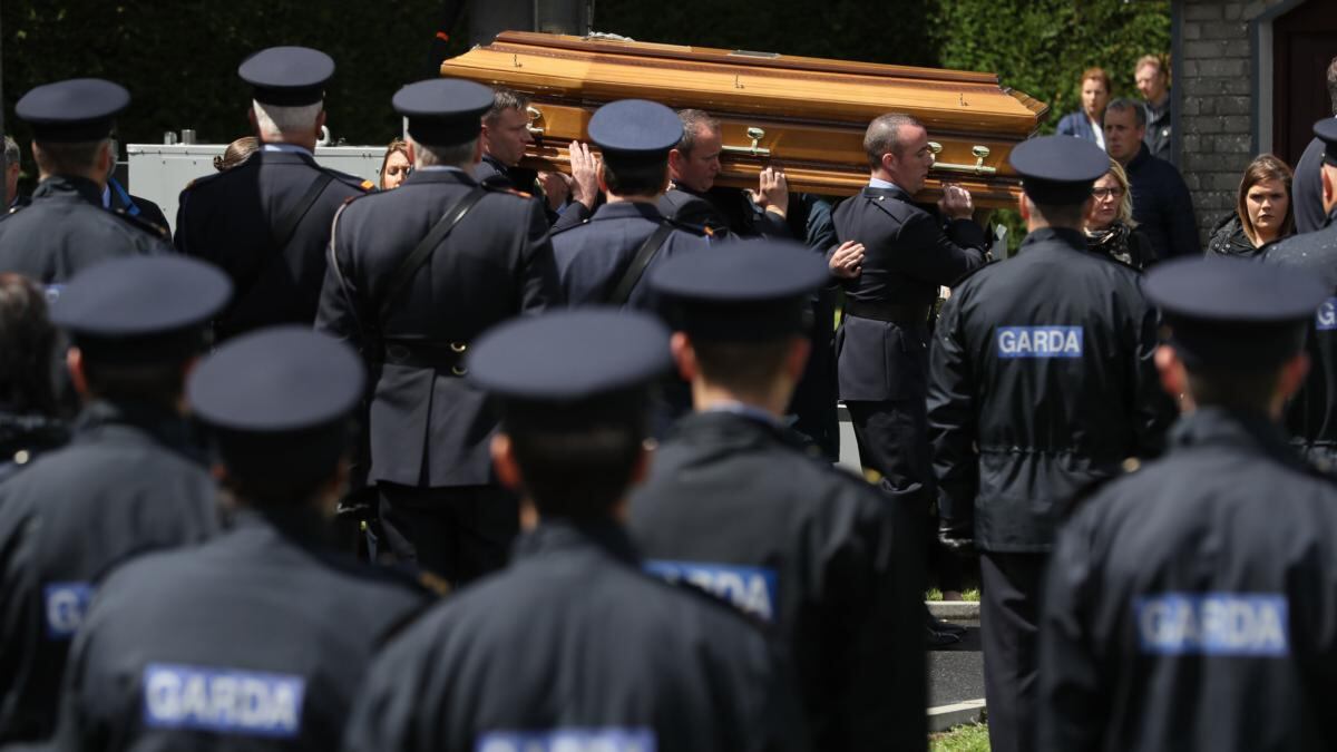 The coffin of Detective Garda Colm Horkan is carried from St James’ church to the cemetery in Charlestown, Co Mayo at his funeral on Sunday afternoon. Photograph: Brian Lawless/PA Wire
