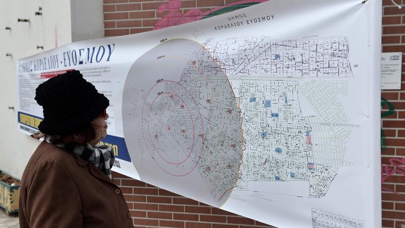 A resident looks at a map showing the radius of evacuation areas, analogous to the potential blast radius, ahead of an operation to defuse a second World War bomb in Kordelio, a suburb of Thessaloniki, Greece, on February 12th, 2017. Photograph: Sakis Mitrolidis/AFP/Getty Images
