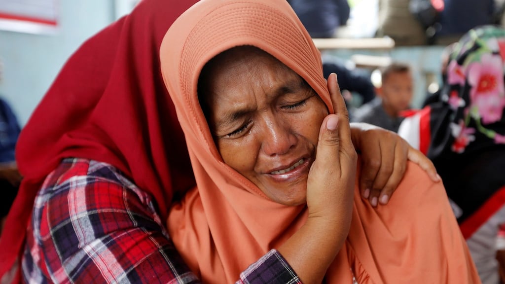 Lela Supiyanti, cries for her daughter, a passenger on the KM Sinar Bangun ferry which sank yesterday in Lake Toba, Indonesia on Monday. Photograph: Beawiharta/Reuters