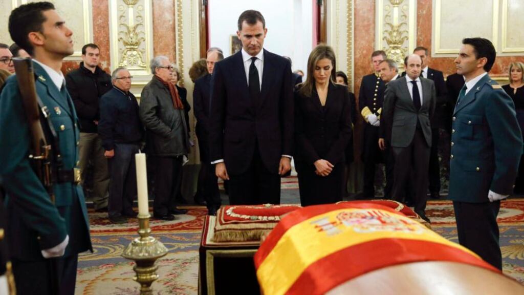 Spain’s Prince Felipe and Princess Letizia stand in front the coffin of former prime minister Adolfo Suárez during his wake at the Spanish parliament in Madrid yesterday. Photograph: Juanjo Martin/Reuters