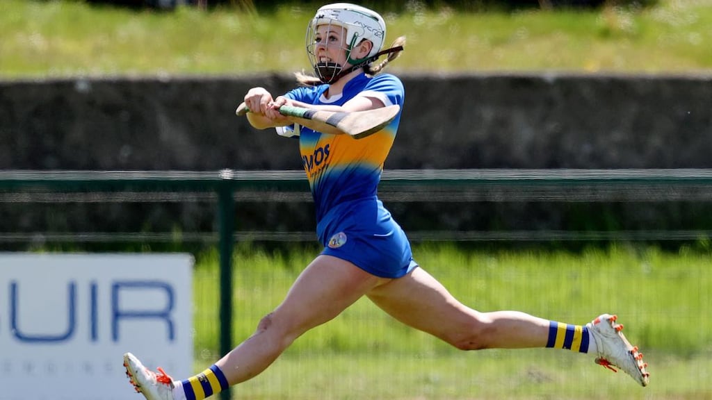 Tipperary’s Clodagh McIntyre scores a point on the run during the Littlewoods Ireland Camogie League Division 1 match against Waterford at Clonmel Commercials GFC. Photograph: Bryan Keane/Inpho