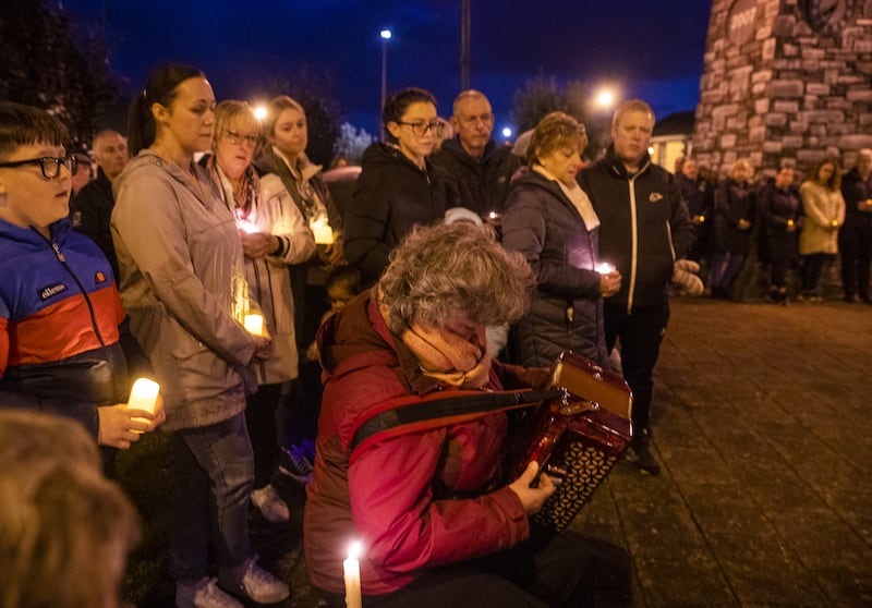 Marian Harper-Coleman plays Cutting the Corn in Creeslough on a button accordion in Castlefinn, Co Donegal, during a vigil for victims of the explosion in Creeslough. Photograph: Liam McBurney/PA