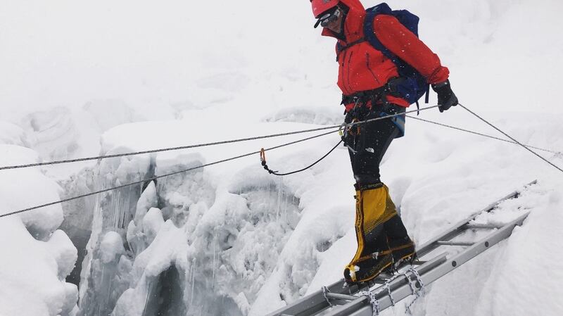 Amy McCulloch crosses a crevasse