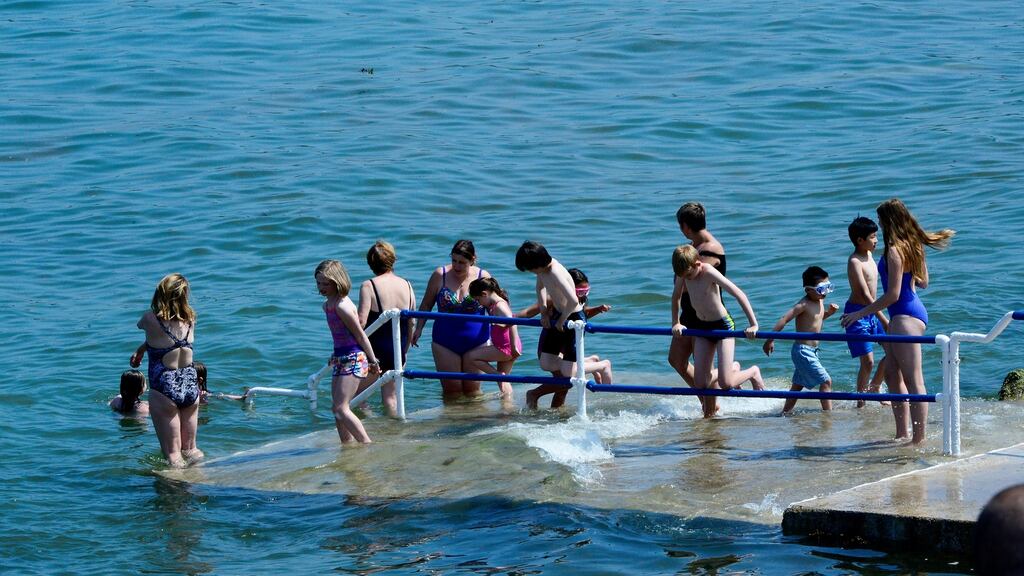 Seapoint is the place to be as swimmers cool off in the hot weather. Photograph: Cyril Byrne/The Irish Times