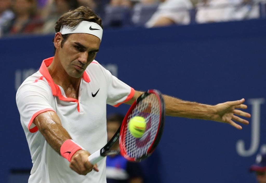 Roger Federer hits a return to Richard Gasquet during their quarter-final tie. Photograph: Adam Hunger/AP