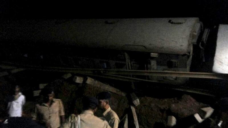 Police stand at the site of a train derailment near Harda, Madhya Pradesh. Two trains were derailed while they were crossing the Machak River. Photograph: Reuters
