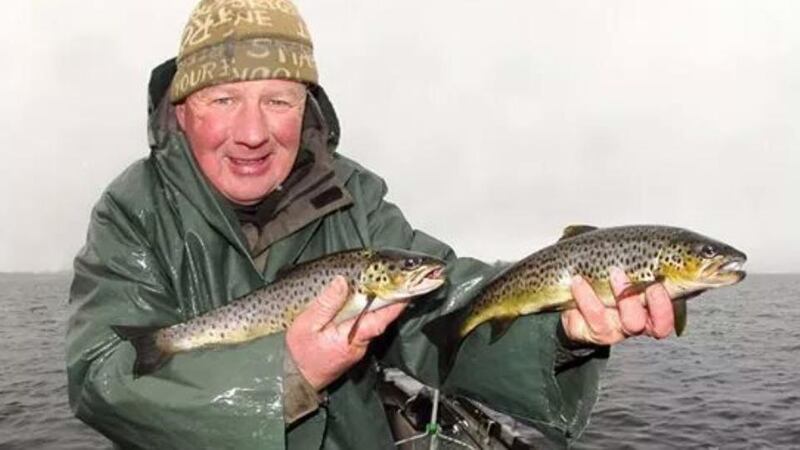 Double scoop: Angling journalist Michael Flanagan with two nice trout from Lough Corrib on opening day last Sunday
