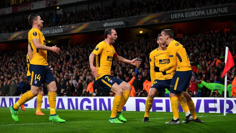 Atlético Madrid celebrate Antoine Griezmann’s late equaliser at the Emirates. Photograph: Dylan Martinez/Reuters
