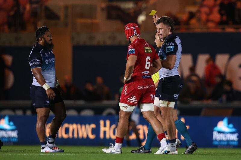 Connacht's Bundee Aki receives a yellow card from referee Marius Van der Westhuizen. Photograph: Ben Brady/Inpho