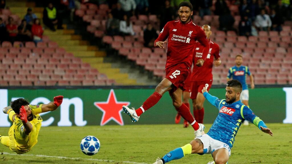 Napoli’s Lorenzo Insigne scores his side’s winning goal past Liverpool goalkeeper Alisson during the Champions League Group C match at Stadio San Paolo. Photograph: Ciro De Luca/Reuters