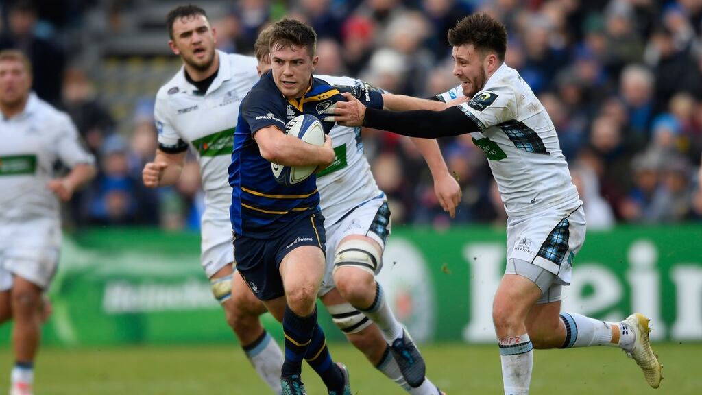 Leinster’s Luke McGrath escapes the clutches of Warriors wing Lee Jones during his side’s 55-19 victory at the RDS. Photograph: Stu Forster/Getty Images
