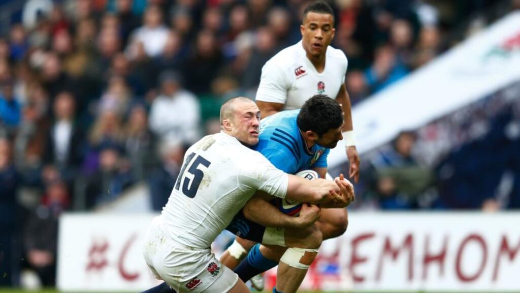 Mike Brown of England clashes with Andrea Masi of Italy during their Six Nations match at Twickenham. The fullback has not fully recovered from his head injury. Photograph: Julian Finney/Getty Images