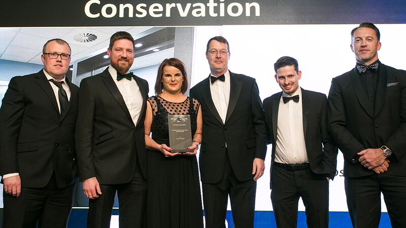 Aaron O'Grady, MD, Vision Creative Studios., presents the Fit-Out Project of the Year – Conservation award to the Manley Construction & O’Mahony Pike Architects teams