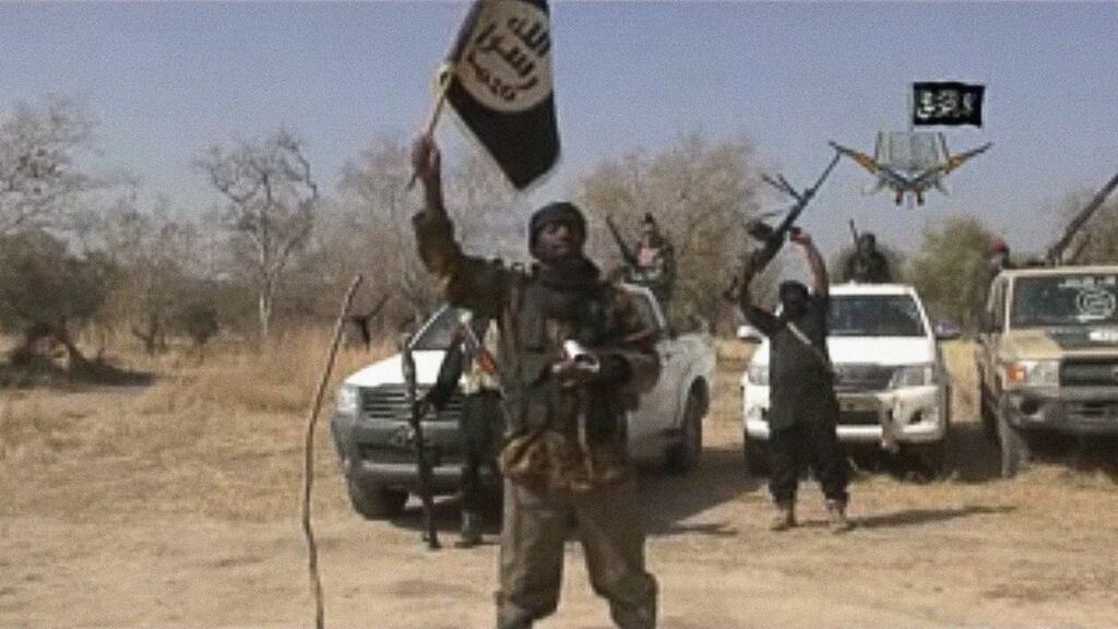 In a 2015 file photograph: Abubakar Shekau, the leader of the Islamist extremist group Boko Haram, holds up a flag. Photograph: AFP/Getty Images