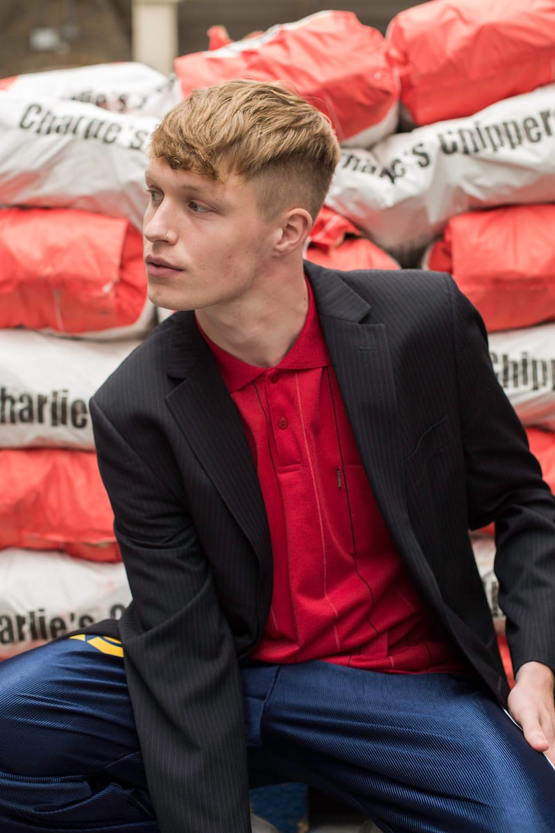 Red polo shirt €5, Gorta, Capel Street, Dublin 1; navy tracksuit bottoms €6, Age Action, Camden Street, Dublin 8; charcoal suit jacket €5, Age Action